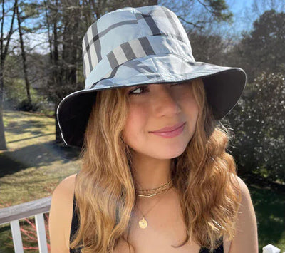 Girl wearing a RainRap hat